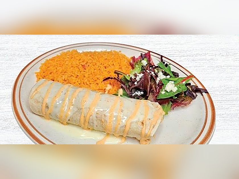 Burrito a la Piña drizzled with chipotle sauce